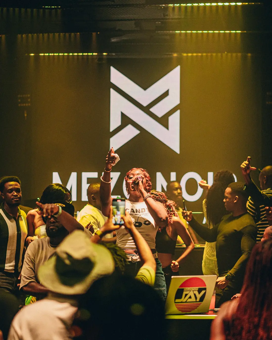 DJ set in front of the Mezo Noir sign