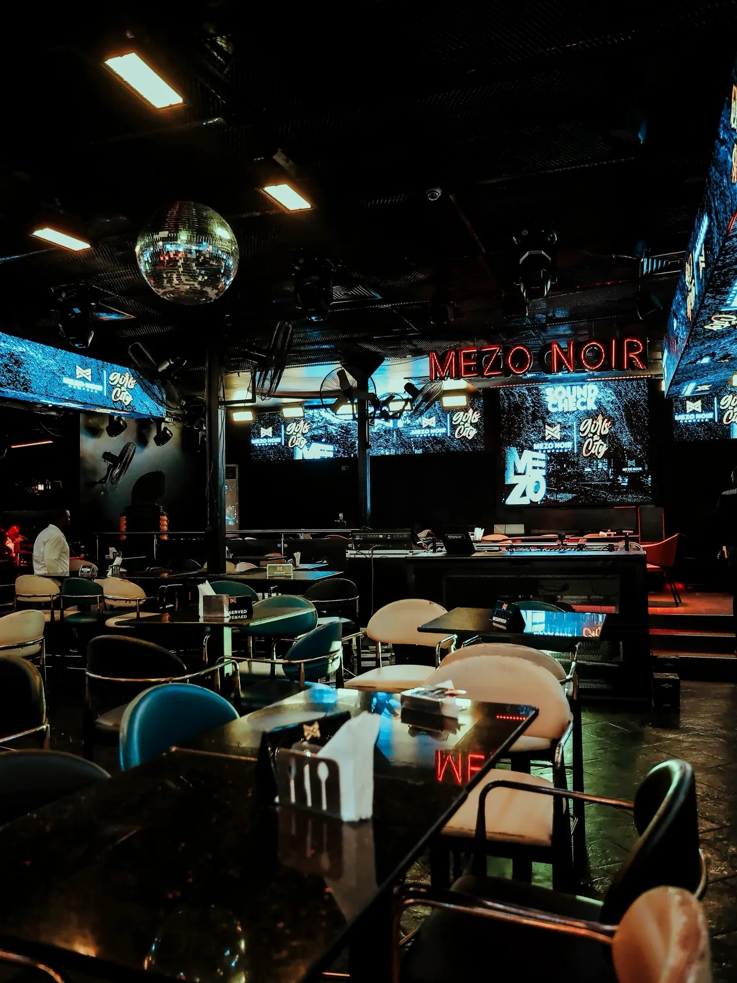 The Champagne Lounge at night, tables set under the lights