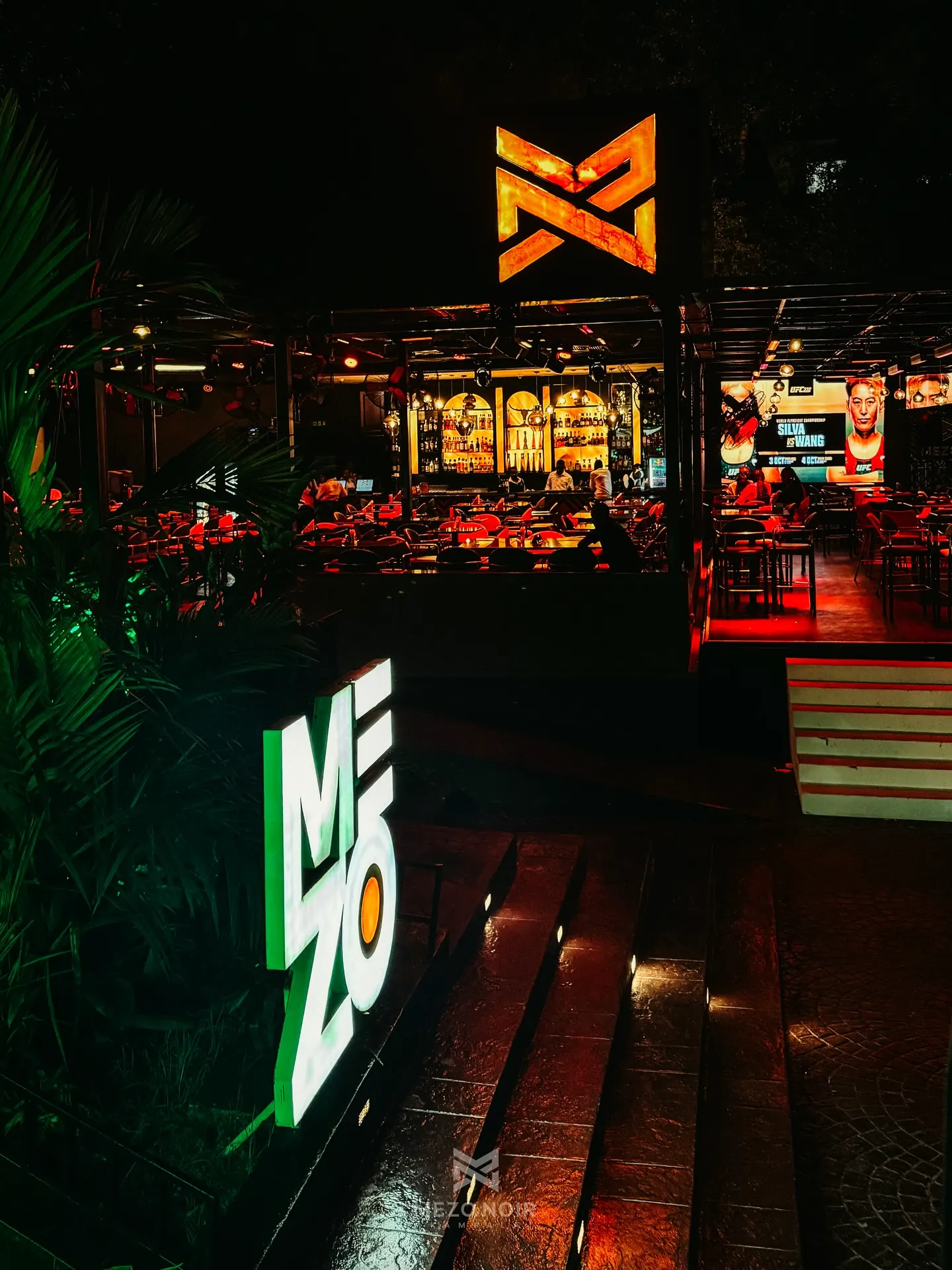 The Mezo Noir courtyard at night