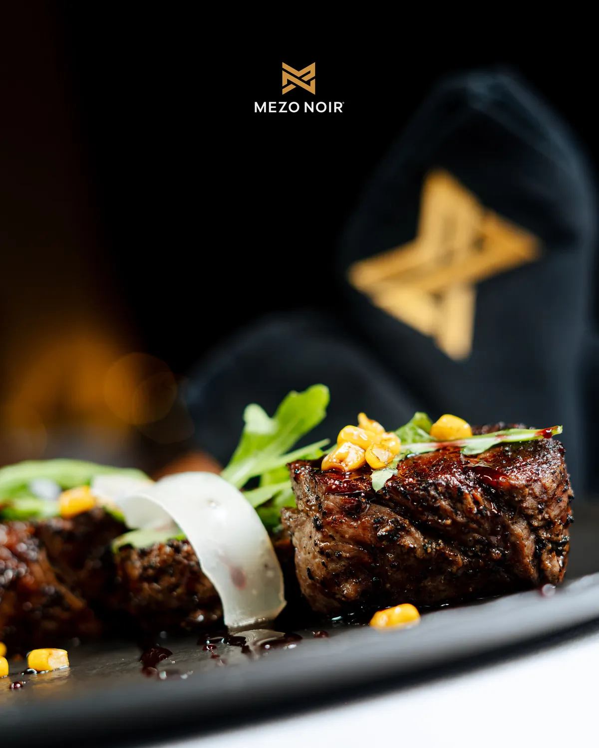 Beef tenderloin with roasted corn, rocket and parmesan